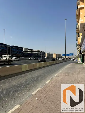للبيع بناية في مويلح – موقع مميز على شارع رئيسي محمد بن زايد