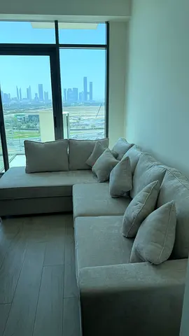Light grey L-shaped fabric corner sofa — good condition 300 x 200 cm - 2300aed negotiable