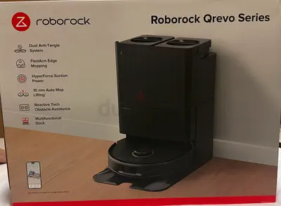 Roborock Q Revo robot vacuum with self-cleaning dock (like new)