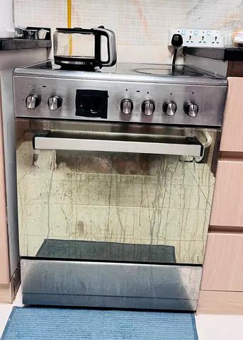 Used freestanding electric oven with stovetop — stainless steel