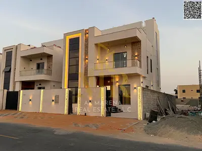 A luxurious modern villa for sale in Al Bahia, featuring a modern design and high-end finishes, with all fees included.