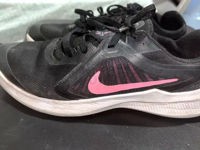 Used Nike womens running shoes, black with pink swoosh, size approx 38