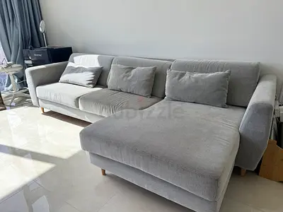 Light grey L-shaped 3-seater sofa with chaise lounge