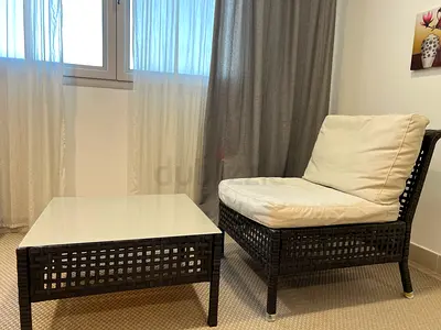 Wicker Lounge Chair with White Cushions and Matching Coffee Table
