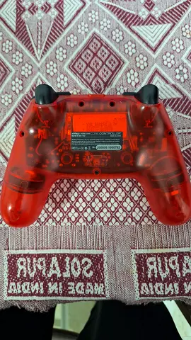 Red translucent NYKO controller (used) - working condition