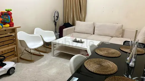 White rocking chair and Ikea chair