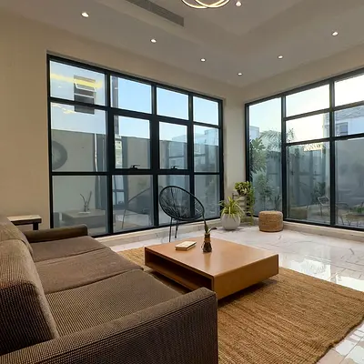 Two-story villa with a roof terrace (G+2), private elevator, spacious majlis and living rooms, luxurious and modern finishes, easy access to Sharjah a