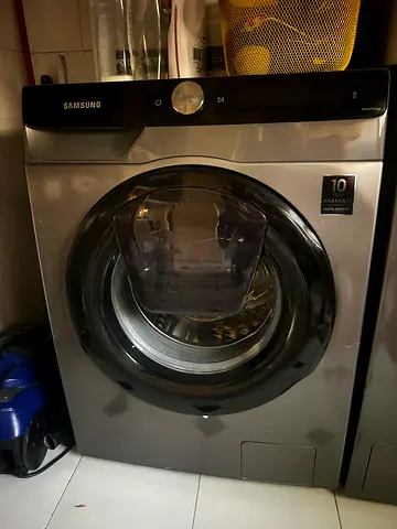 Samsung front load washing machine with AddWash door - good condition.