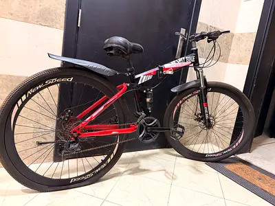 Used red/black mountain bike - 26 wheels, Shimano gears Orginal price 900