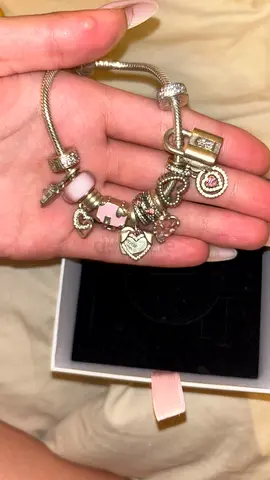 PANDORA Silver charm bracelet with multiple charms (pre-owned, 700+ dirhams in charms)