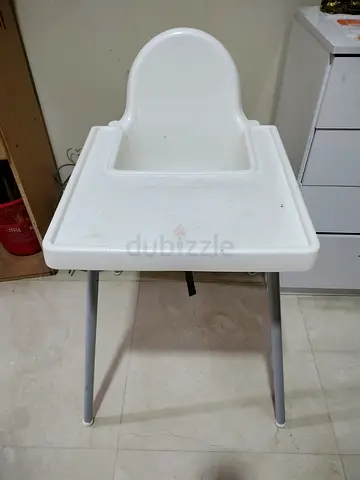 Simple white plastic baby high chair with tray - used