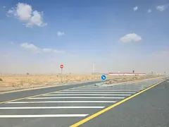 Commercial land for sale in Sharjah, Rawdat Al Qurt area, Al Ruwaidat suburb.