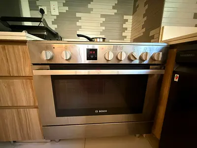 Bosch Stainless Steel Gas Cooker with Oven - Good Working Condition
