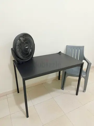 Simple black study table with grey plastic chair — used, good condition