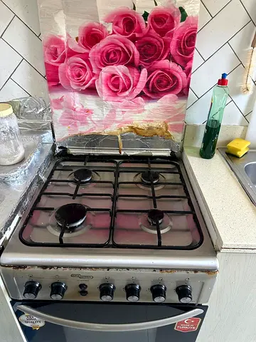 Used 4-Burner Gas Stove with Oven - Functional, needs cleaning