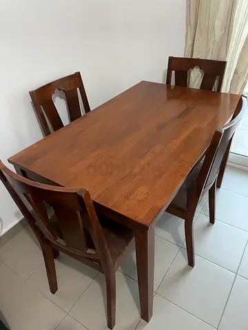 Solid Wood Dining Table with 4 Chairs - Excellent Condition. Priced very low.