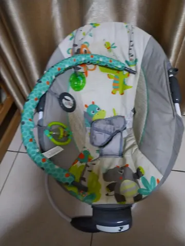 Baby rocker/bouncer seat with toy bar - used, good condition