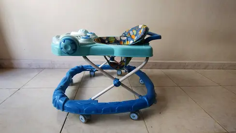 Blue baby walker with activity tray — good used condition