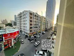 For rent in Al Karama 🌟 One-bedroom apartment with a living room, kitchen, bathroom, and balcony 
