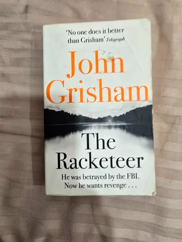 The Racketeer by John Grisham - Paperback (used)