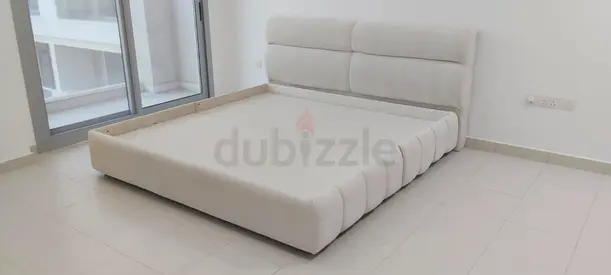 Beige Upholstered King Bed with Padded Headboard - Good Condition