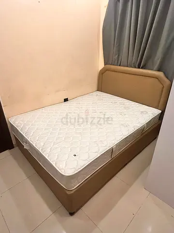 King bed frame with upholstered headboard, mattress