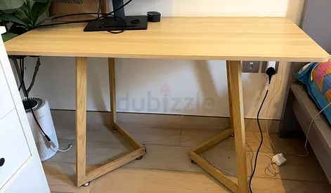 Light wood study desk with angled trestle legs - good condition