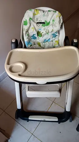 Used baby high chair with washable seat cover