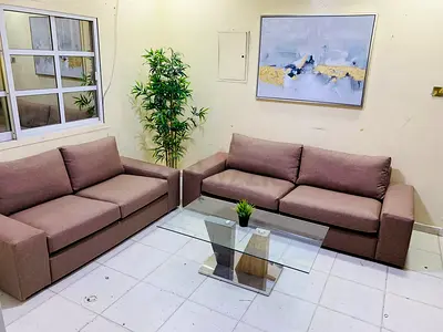 Two-Piece Brown Fabric Sofa Set with Glass Coffee Table