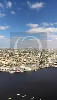 One-bedroom apartment in Al Waha Towers for sale, with a creek view.