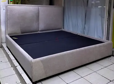 King-size upholstered platform bed frame with cushioned headboard