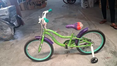 Green childrens bicycle with training wheels - good condition
