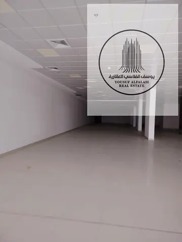 Shop for rent in Al Rashidiya 1 on a main commercial street. Area: 13,000 sq ft. Final price: AED 7