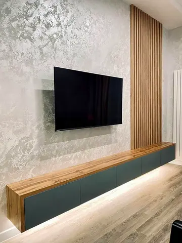 Modern wall-mounted TV unit with wooden slat feature