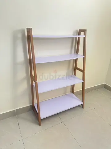 Pyramid shelf unit for plants, décor, or storage. In good condition and well maintained.