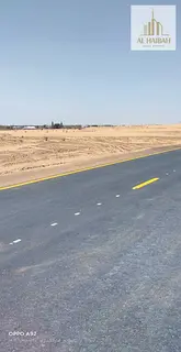 Two adjacent residential plots for sale in Rawdat Al Qurt, Sharjah.