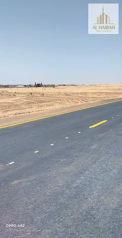 Two adjacent residential plots for sale in Rawdat Al Qurt, Sharjah.