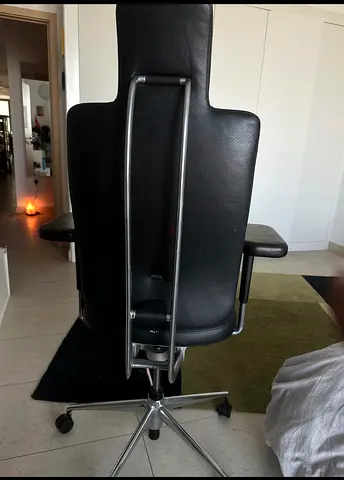 Black ergonomic leather office chair with headrest