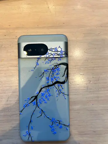 Used Android smartphone with decorative floral case - good condition Google pixel 8