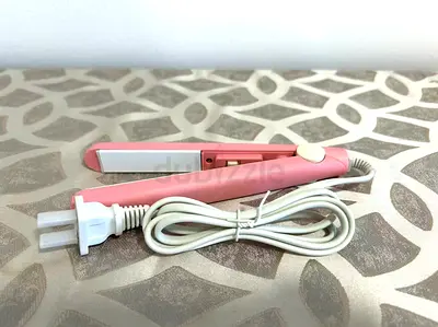 Compact pink mini hair straightener