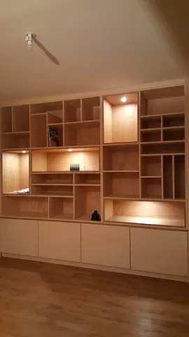 Custom Built-in Wooden Bookcase with Integrated Lighting