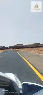 Residential lands for sale in Sharjah, Al Zubair Orchards area, opposite Emirates Road. Very prime l