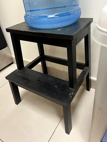 Small black wooden stool / side table - sturdy, used