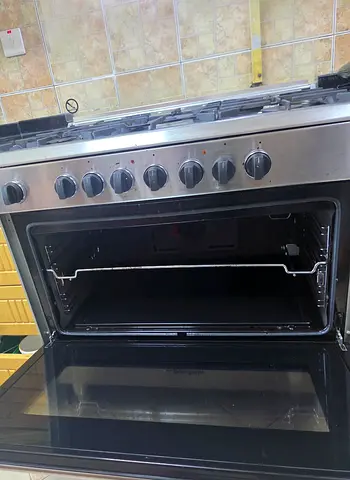 Stainless Steel 6-Burner Gas Cooker with Oven - Good Working Condition