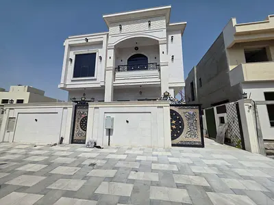 🏠Villa for rent – ​​Al Helio 2, Ajman (First occupancy | Classic design) 5 master bedrooms, living room, majlis, maid's room, central air conditionin