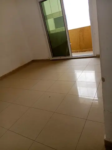 One bedroom apartment for rent in Al Khan Sharjah balcony spacious kitchen built in wardrobes central AC on landlord sandy parking price 33000 yearly