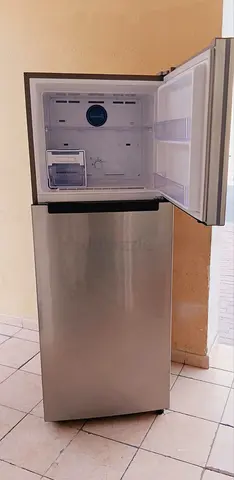 Compact stainless steel top-freezer refrigerator - good working condition