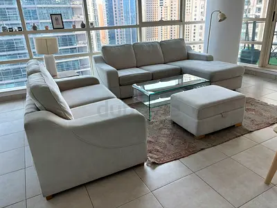 Light grey L-shaped 4-seater fabric sofa with ottoman (good condition)
