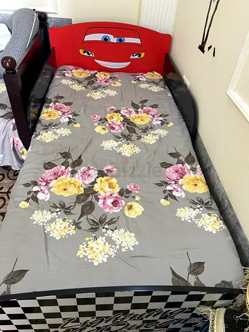 Kids single bed frame with Cars headboard and floral mattress (good condition)
