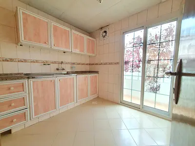 NO DEPOSIT CASH 1BHK WITH BALCONY ON ROAD BUILDING IN MUWAILEH